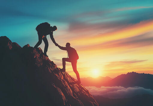 Silhouette of a climber helping another up a summit, symbolizing guidance and summary reporting